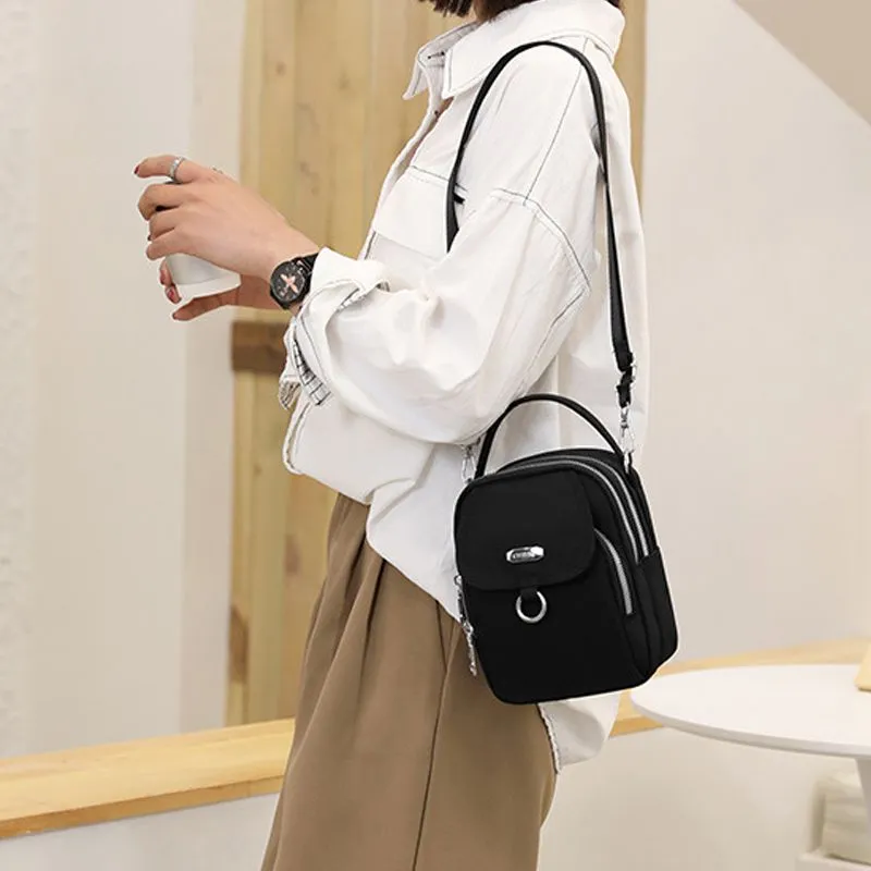 Light and waterproof shoulder bag with several pockets